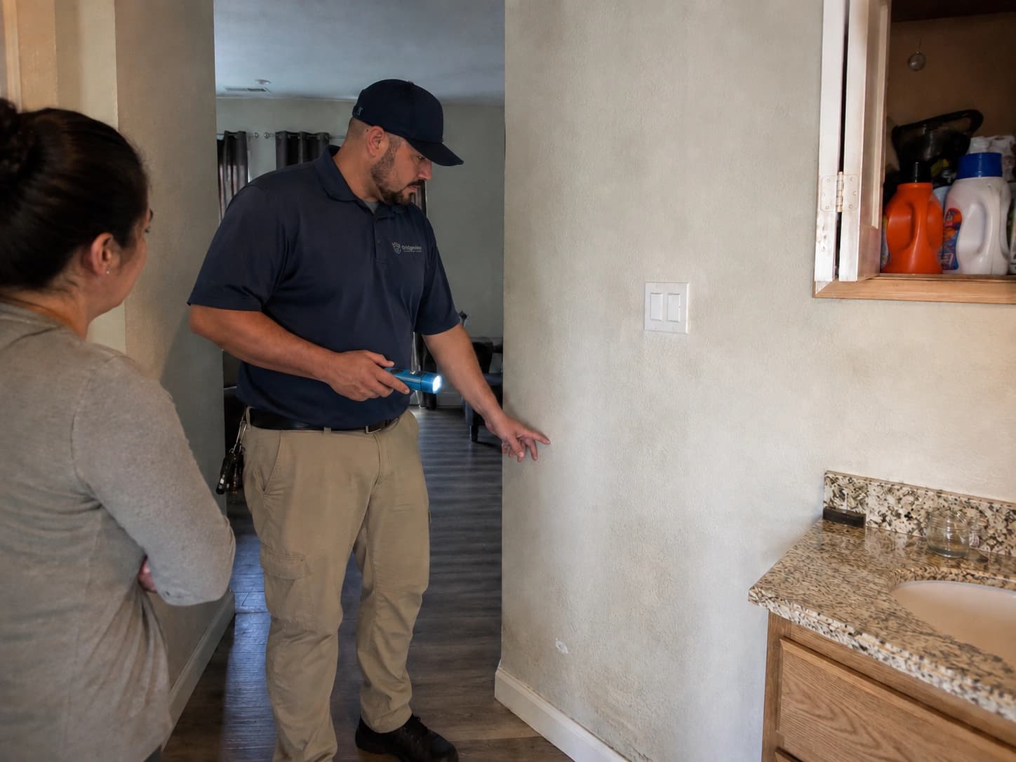 Mold remediation technician speaking with an Antioch homeowner before an inspection